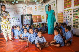 Teacher and students at a Pre-school in Malinchora Village. Bangladesh.