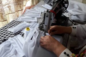 Istoray sews face masks to meet the growing demand in her community in Baghlan, Afghanistan, during the COVID-19 pandemic.