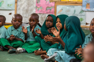 750B4941 Caption: Children sing and clap during the Kindergarten One class at Ummul Qura Primary School in Mbuwani, Kwale County, Kenya.
Location: Mbuwani Village, Kwale County, Kenya
Project: SESEA
Institution: AKF