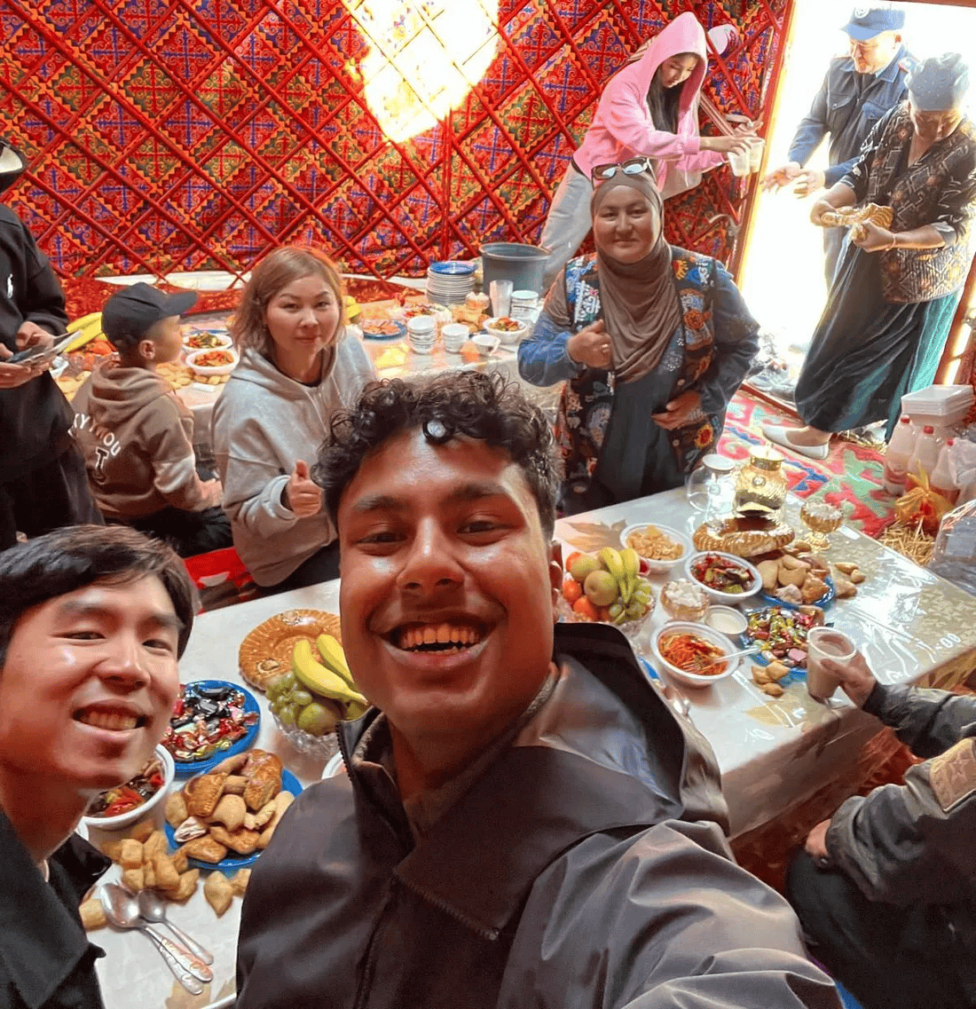 A group of young people gathered around the table.
