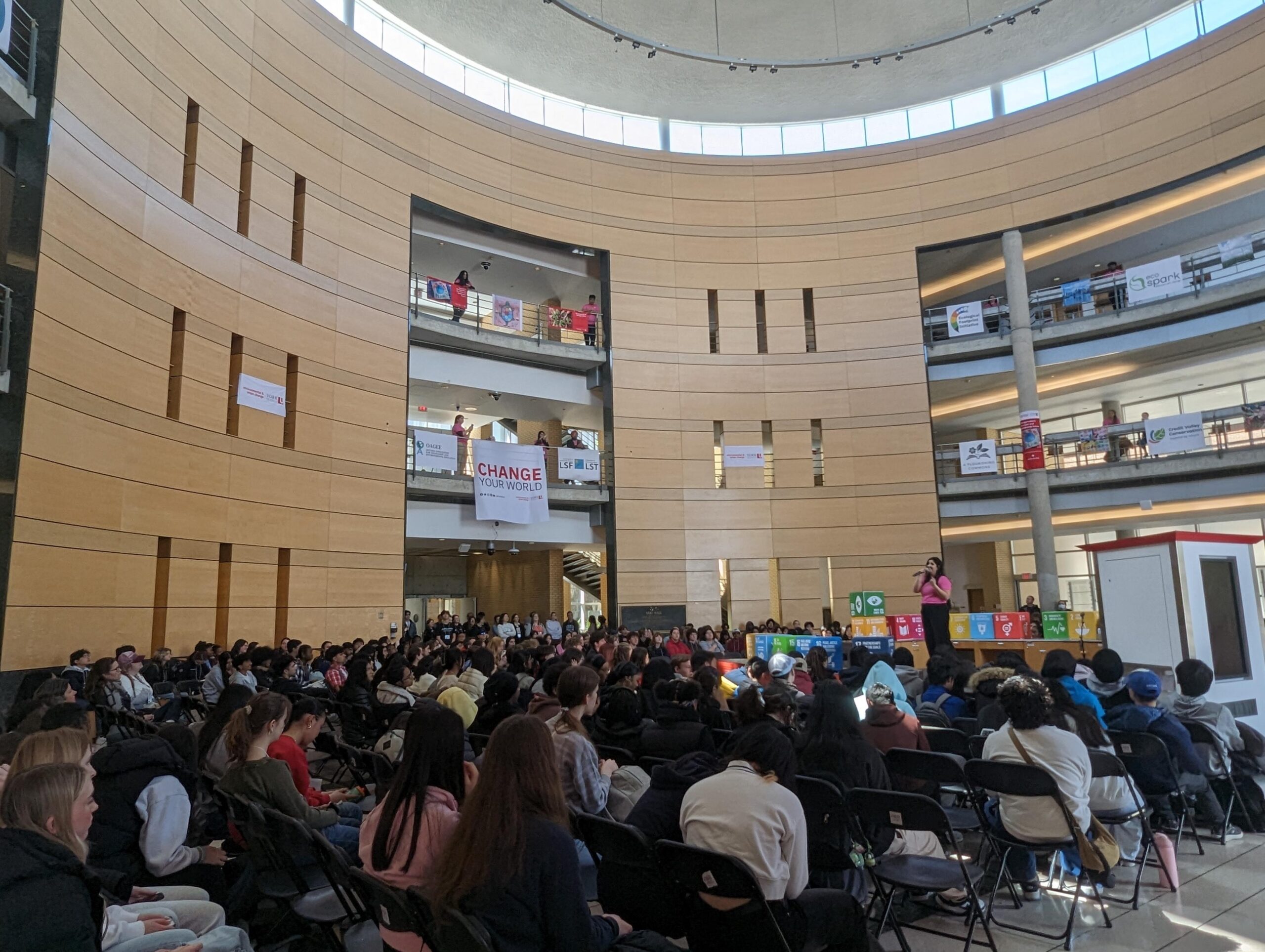 A room of people in a hall.